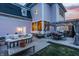 Cozy backyard patio with comfortable seating, string lights, and a charming pergola dining area at 12813 Chapel Square St, Carmel, IN 46032