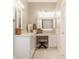 Bright bathroom with vanity and drawers, marble countertops, and decor accents at 12813 Chapel Square St, Carmel, IN 46032
