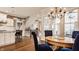 View of dining area leading to gourmet eat-in kitchen and staircase at 12813 Chapel Square St, Carmel, IN 46032