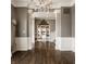 Spacious foyer with detailed trim work, hardwood floors, and elegant decor at 12813 Chapel Square St, Carmel, IN 46032