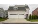 Charming home with a spacious two-car garage, well-maintained landscaping, and inviting curb appeal at 12813 Chapel Square St, Carmel, IN 46032
