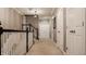 Upstairs hallway with neutral carpet and white trim, leading to bedrooms and storage at 12813 Chapel Square St, Carmel, IN 46032