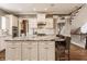 Stylish kitchen with a large island, stainless steel appliances, white cabinets, and a convenient breakfast bar at 12813 Chapel Square St, Carmel, IN 46032