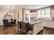 Eat-in kitchen featuring island with granite countertops and stainless steel appliances at 12813 Chapel Square St, Carmel, IN 46032