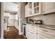 Bright kitchen features white cabinets, granite countertops, and stainless steel appliances at 12813 Chapel Square St, Carmel, IN 46032