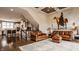 View from living room into kitchen highlighting open floor plan with hardwood floors at 12813 Chapel Square St, Carmel, IN 46032