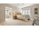 Serene bedroom with natural light, ensuite bathroom, and neutral decor at 12813 Chapel Square St, Carmel, IN 46032