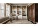 Office with custom built-in shelving, a modern desk, and natural light at 12813 Chapel Square St, Carmel, IN 46032