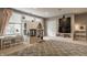 Inviting playroom with a charming playhouse, large windows and a cozy rug for to enjoy at 12813 Chapel Square St, Carmel, IN 46032