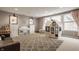 Bright playroom featuring a white piano, playhouse, comfortable seating, and ample space for imaginative play at 12813 Chapel Square St, Carmel, IN 46032