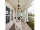 Relaxing front porch with white rocking chairs, perfect for enjoying the neighborhood ambiance at 12813 Chapel Square St, Carmel, IN 46032