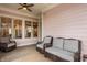 Comfortable sunroom with wicker seating, neutral rug, and views through windows to the outside at 12813 Chapel Square St, Carmel, IN 46032