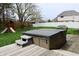 Relaxing backyard featuring a hot tub, patio, and play set for outdoor enjoyment at 13116 N Departure W Blvd, Camby, IN 46113