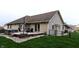 Landscaped backyard with a patio, hot tub, and ample space for outdoor entertainment and relaxation at 13116 N Departure W Blvd, Camby, IN 46113
