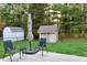 Private backyard setting with outdoor seating, a shed, and lush greenery for relaxation at 13116 N Departure W Blvd, Camby, IN 46113