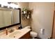 Bright bathroom features a framed mirror, toilet, and shelving decor for added storage and appeal at 13116 N Departure W Blvd, Camby, IN 46113