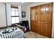 A charming bedroom features a twin bed and a large closet that offers plenty of storage at 13116 N Departure W Blvd, Camby, IN 46113