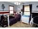 This bedroom boasts a playful theme, including a bunk bed, desk, and themed decor at 13116 N Departure W Blvd, Camby, IN 46113