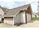 Home exterior showing the attached garage, neutral siding, and well-maintained roof and gutters at 13116 N Departure W Blvd, Camby, IN 46113