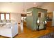 Spacious living room featuring hardwood floors and a comfortable sectional sofa at 13116 N Departure W Blvd, Camby, IN 46113