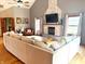 Inviting living room features a brick fireplace, TV, hardwood floors, and comfortable seating at 13116 N Departure W Blvd, Camby, IN 46113