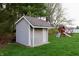 Outdoor shed with siding for storage, situated on a well-maintained lawn at 13116 N Departure W Blvd, Camby, IN 46113