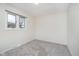 Bright bedroom with a large window and neutral carpeting at 1313 Roseway Dr, Indianapolis, IN 46219