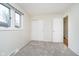 Sunlit bedroom includes closet and new carpet at 1313 Roseway Dr, Indianapolis, IN 46219