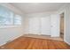 Bedroom with a window, hardwood floors, and closet at 1313 Roseway Dr, Indianapolis, IN 46219