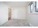 Bedroom featuring a window, closet, and neutral carpet at 1313 Roseway Dr, Indianapolis, IN 46219
