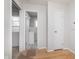 Hallway showing entry to a bathroom and the back door of this home at 1313 Roseway Dr, Indianapolis, IN 46219