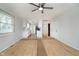 Open living space with white walls, wood-look floors, and a view into the kitchen area at 1313 Roseway Dr, Indianapolis, IN 46219