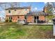 Backyard view of brick home with patio, pergola, and hot tub at 1320 Bittersweet Dr, Greenfield, IN 46140