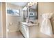 Bathroom featuring dual sinks, granite counters, and neutral decor at 1320 Bittersweet Dr, Greenfield, IN 46140