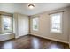 Bright bedroom with wood floors, large windows, and a built-in bench at 1320 Bittersweet Dr, Greenfield, IN 46140