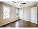 Bedroom featuring hardwood floors, neutral walls, and a ceiling fan at 1320 Bittersweet Dr, Greenfield, IN 46140