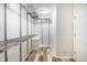 Walk-in closet with metal shelving and wood-look flooring at 1320 Bittersweet Dr, Greenfield, IN 46140