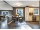 A breakfast nook features a round table and bright windows next to the kitchen at 1320 Bittersweet Dr, Greenfield, IN 46140