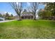 Charming two-story home with a well-manicured lawn and mature trees at 1320 Bittersweet Dr, Greenfield, IN 46140