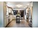 A spacious kitchen features stainless steel appliances, light cabinetry, and an island bar at 1320 Bittersweet Dr, Greenfield, IN 46140