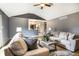 A living room features a ceiling fan, a fireplace, and hardwood floors at 1320 Bittersweet Dr, Greenfield, IN 46140