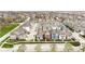 Stunning aerial view of a neighborhood featuring colorful homes, well-maintained streets, and mature trees at 13245 E 131St St, Fishers, IN 46037