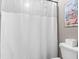 Bathroom featuring a white shower curtain and a toilet next to surf decor at 13245 E 131St St, Fishers, IN 46037