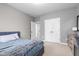 Bedroom featuring a bed and dresser, with doorways providing depth and multiple access points at 13245 E 131St St, Fishers, IN 46037
