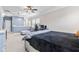 Open bedroom featuring a gray color scheme, large windows, and a spacious seating area, providing ample natural light at 13245 E 131St St, Fishers, IN 46037