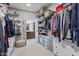 A walk-in closet featuring wire shelving, organizers, a soft ottoman, and lots of storage space at 13245 E 131St St, Fishers, IN 46037