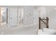 Bright hallway boasts neutral gray carpet, white trim, and multiple doorways for a flexible, functional layout at 13245 E 131St St, Fishers, IN 46037
