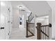 Upstairs hallway featuring white trim, carpet, and modern lighting at 13245 E 131St St, Fishers, IN 46037