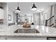 Bright kitchen showcasing the sink in an island with granite countertops, and an open layout to the living spaces at 13245 E 131St St, Fishers, IN 46037