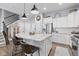 Bright and modern kitchen featuring a large island, stainless steel appliances, and white cabinets at 13245 E 131St St, Fishers, IN 46037
